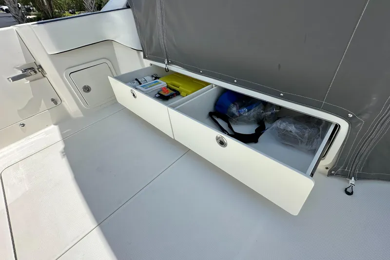 Slide: The Image of 2021 World Cat 400 DC-X boat storage compartments open. - 20