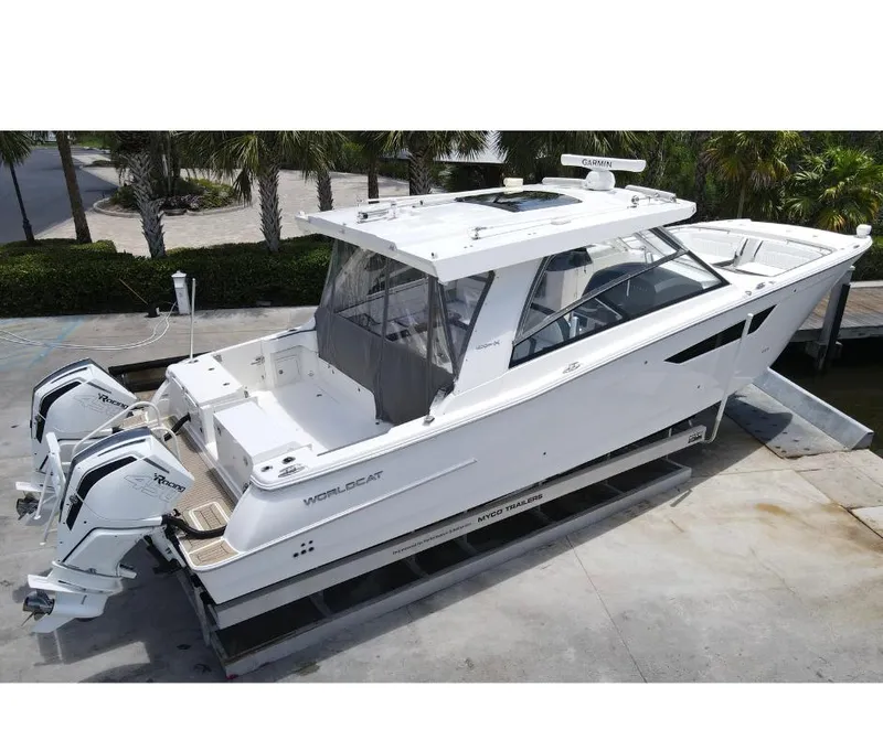 Slide: The Image of 2021 World Cat 400 DC-X boat on a trailer with twin outboard engines. - 3