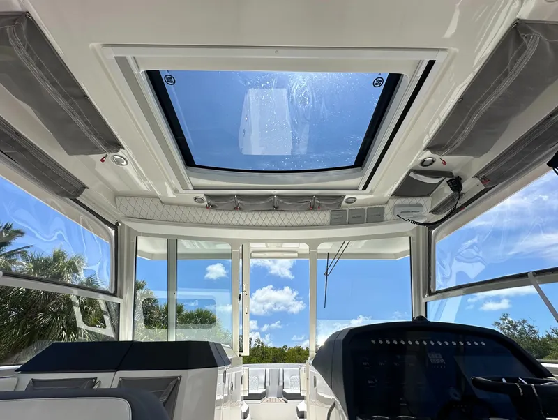 Slide: The Image of Interior view of 2021 World Cat 400 DC-X boat with skylight and cockpit. - 30