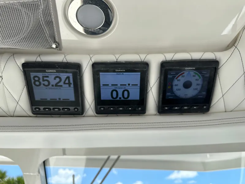 Slide: The Image of Digital displays on the 2021 World Cat 400 DC-X boat dashboard. - 32