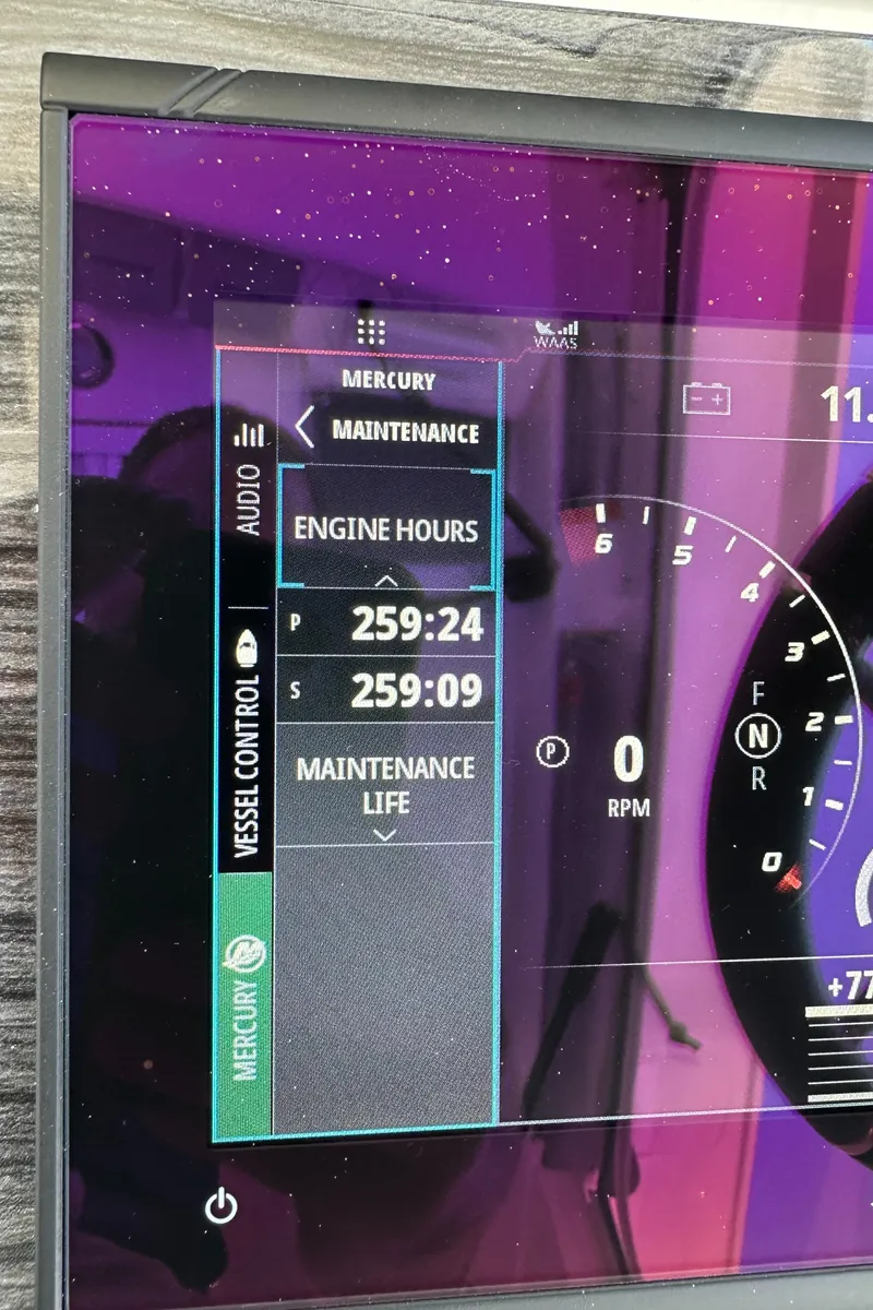 Slide: The Image of Digital display showing engine hours and maintenance life on a 2021 World Cat 400 DC-X. - 34