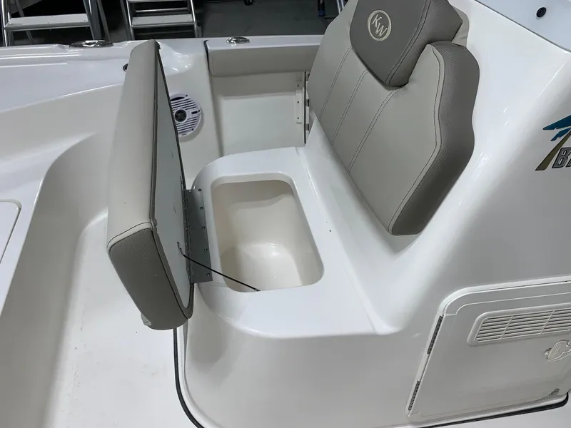 Slide: The Image of 2024 Key West 188 Bay Reef boat with open storage compartment under seat. - 8