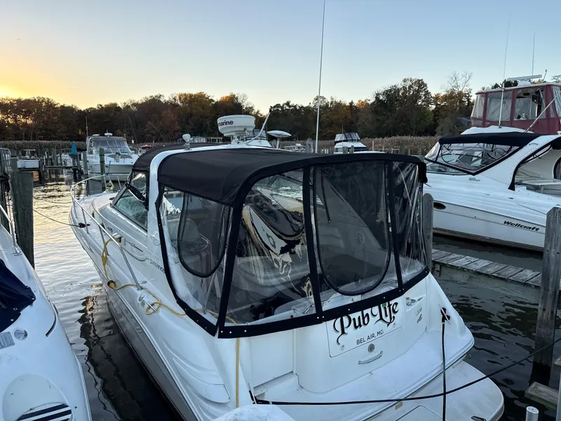 Slide: The Image of 1998 Sea Ray 330 Sundancer docked at marina during sunset. - 17