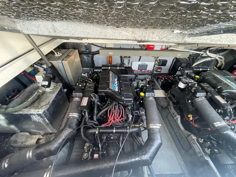 Slide: The Image of 1998 Sea Ray 330 Sundancer engine compartment with twin MerCruiser engines. - 18