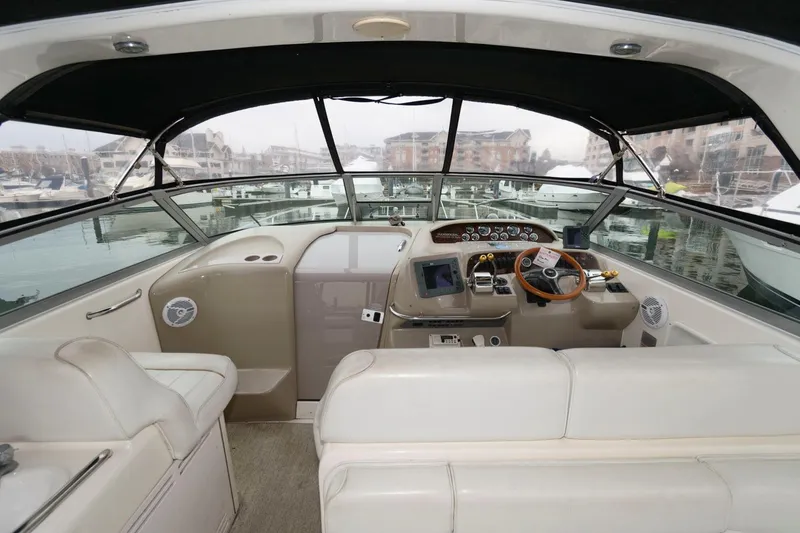 Slide: The Image of Interior view of 1998 Sea Ray 330 Sundancer yacht cockpit with steering wheel and controls. - 3