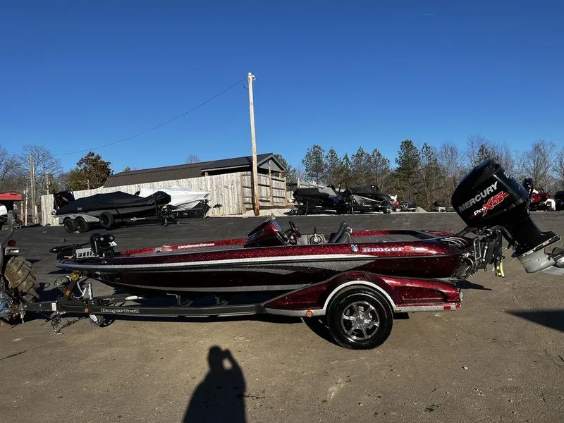 The Image of 2018 Ranger Z519C bass boat with Mercury outboard motor on trailer. - 1