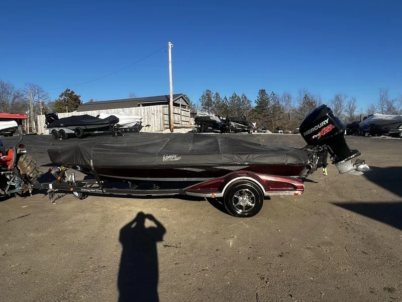 Slide: The Image of 2018 Ranger Z519C boat with cover and Mercury outboard motor in outdoor storage. - 3
