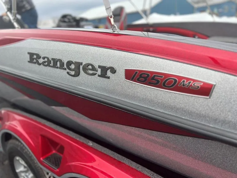 Slide: The Image of 2023 Ranger 1850MS boat in red and silver close-up. - 2