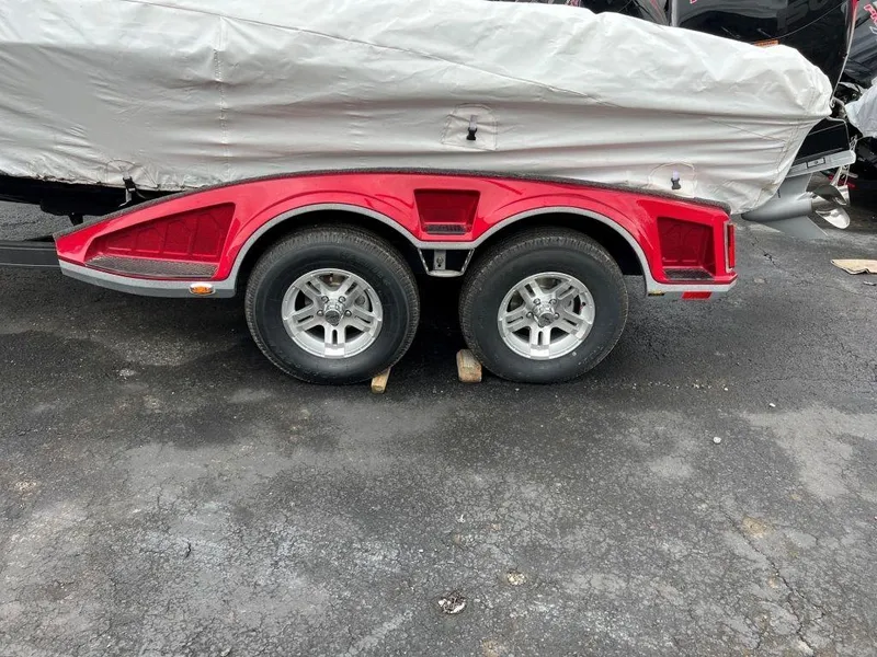 Slide: The Image of 2023 Ranger 1850MS boat trailer with red fenders and covered boat. - 8