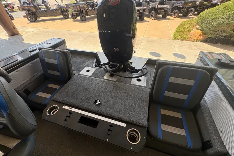 Slide: The Image of 2023 Ranger VX1788 WT boat interior with seating and motor, showcasing modern design. - 27