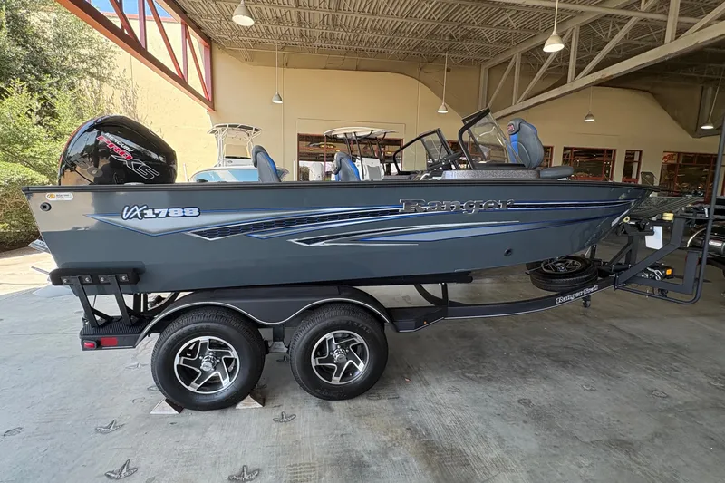 Slide: The Image of 2023 Ranger VX1788 WT boat on trailer in showroom setting. - 6