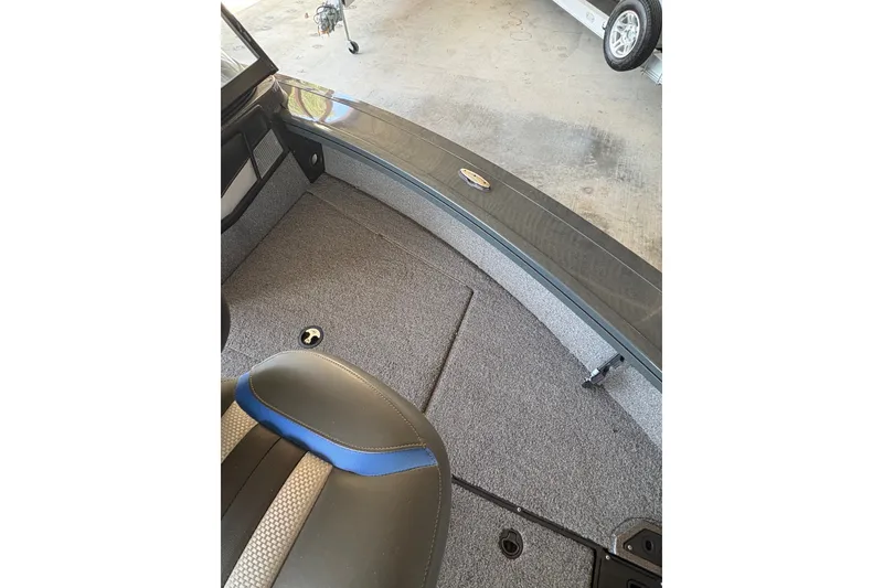 Slide: The Image of 2023 Ranger VX1788 WT boat interior with gray carpet and seating. - 12