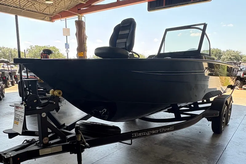 Slide: The Image of 2023 Ranger VX1788 WT boat on trailer in covered area, side view. - 1