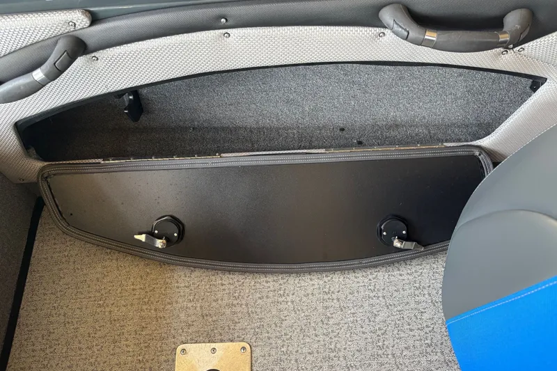 Slide: The Image of 2023 Ranger VX1788 WT boat interior storage compartment with gray and blue seating. - 33