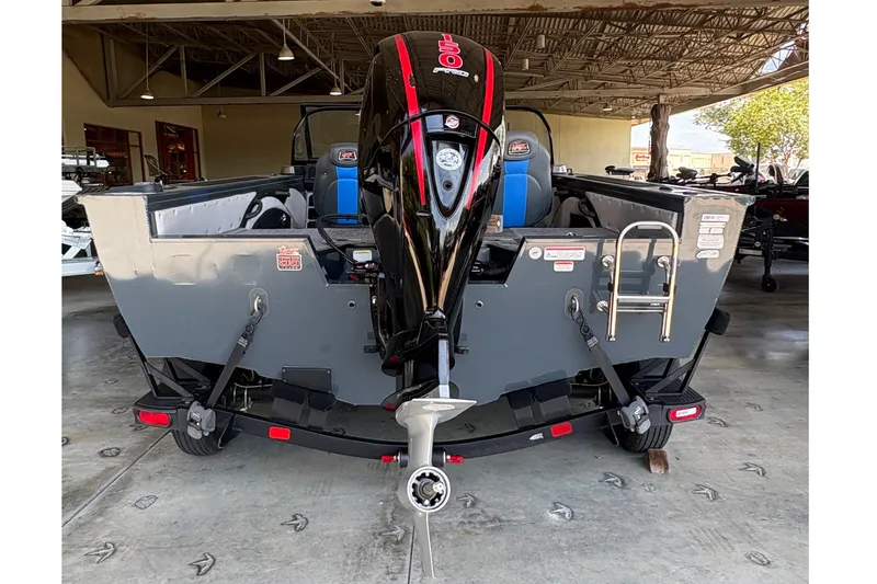 Slide: The Image of 2023 Ranger VX1788 WT boat with powerful outboard motor in a showroom. - 4