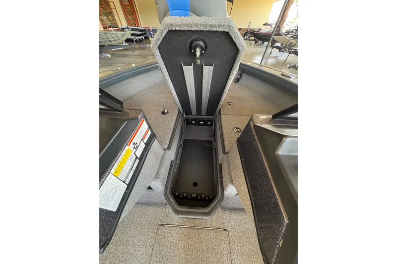 Slide: The Image of 2023 Ranger VX1788 WT boat interior storage compartment, open lid view. - 16
