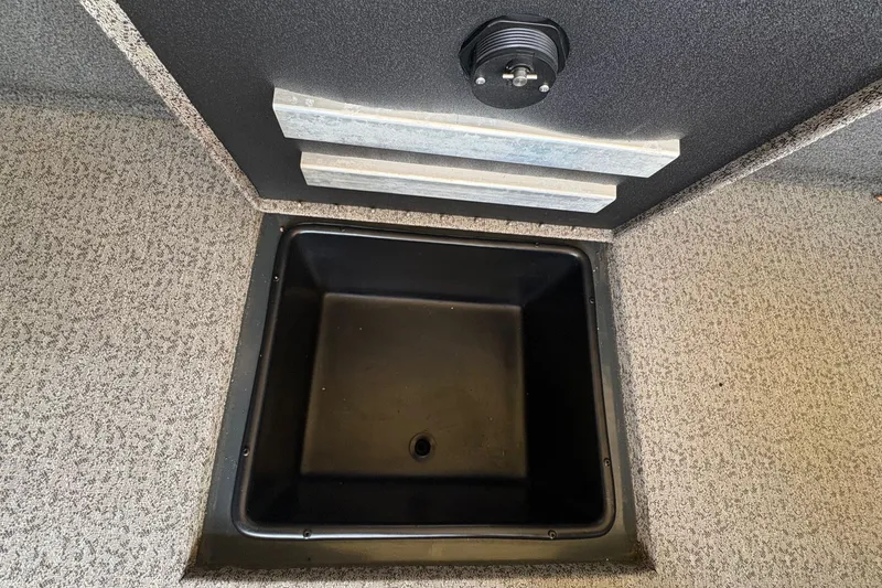 Slide: The Image of Close-up of a storage compartment on a Ranger VX1788 WT boat. - 25