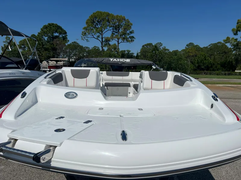 Slide: The Image of 2023 Tahoe 2150 boat, white deck, spacious seating, outdoor setting. - 4