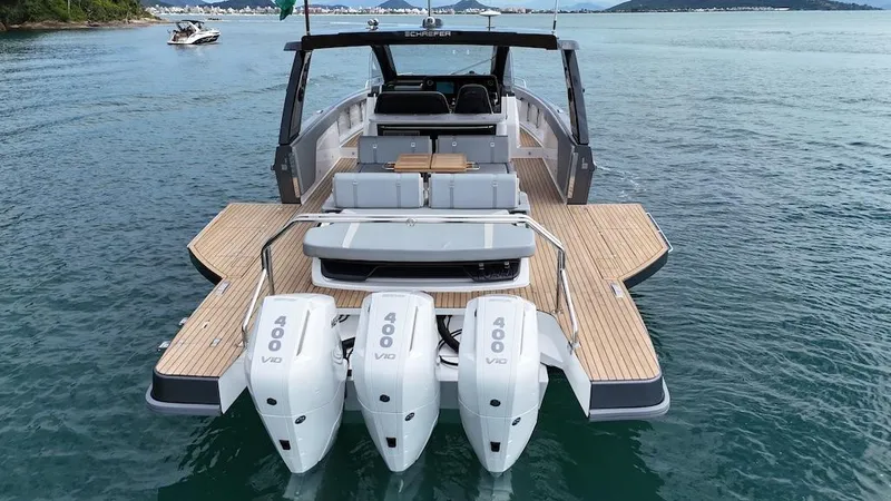 Slide: The Image of Schaefer V44 2025 luxury yacht with triple 400 V10 engines on open water. - 18