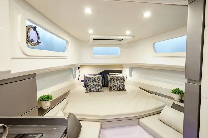 Slide: The Image of Luxurious interior of 2025 Schaefer V44 yacht with modern decor and comfortable bedding. - 20