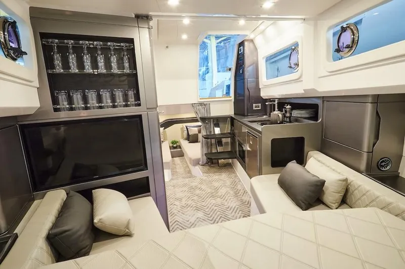 Slide: The Image of Luxurious interior of 2025 Schaefer V44 yacht with modern kitchen and seating area. - 22