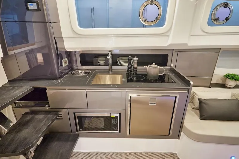 Slide: The Image of Modern kitchen in 2025 Schaefer V44 yacht with stainless steel appliances and sleek design. - 23