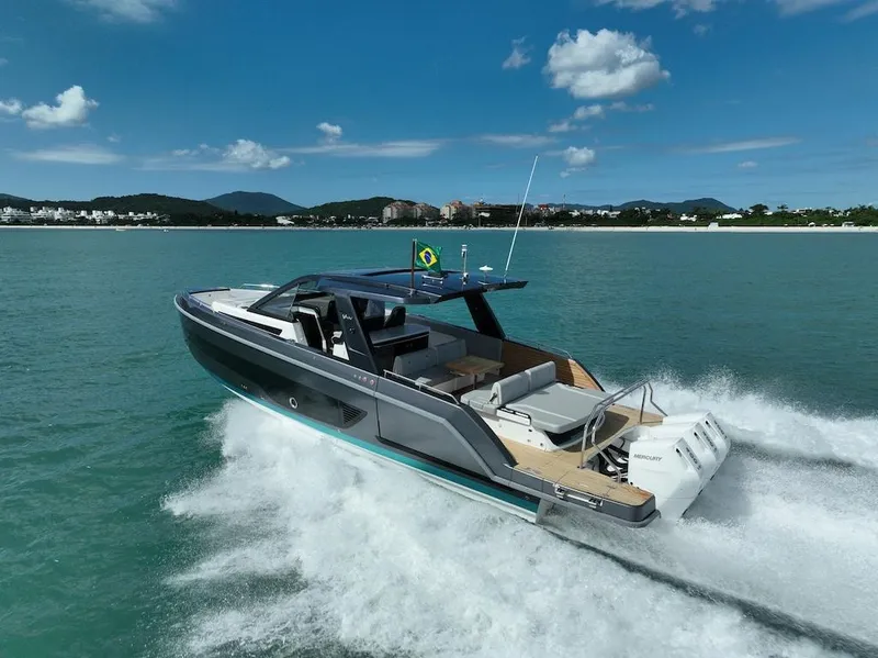 Slide: The Image of Schaefer V44 2025 luxury yacht cruising on clear blue waters. - 5