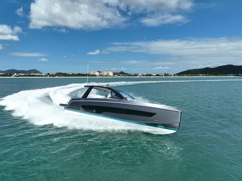 Slide: The Image of Schaefer V44 2025 luxury yacht cruising on clear blue waters under a sunny sky. - 6