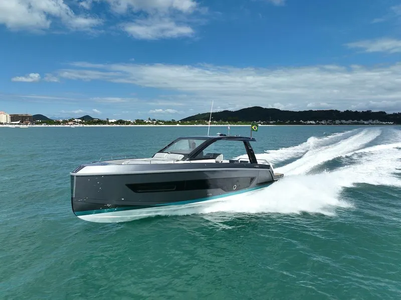 Slide: The Image of Schaefer V44 2025 luxury yacht cruising on clear blue waters under a sunny sky. - 7