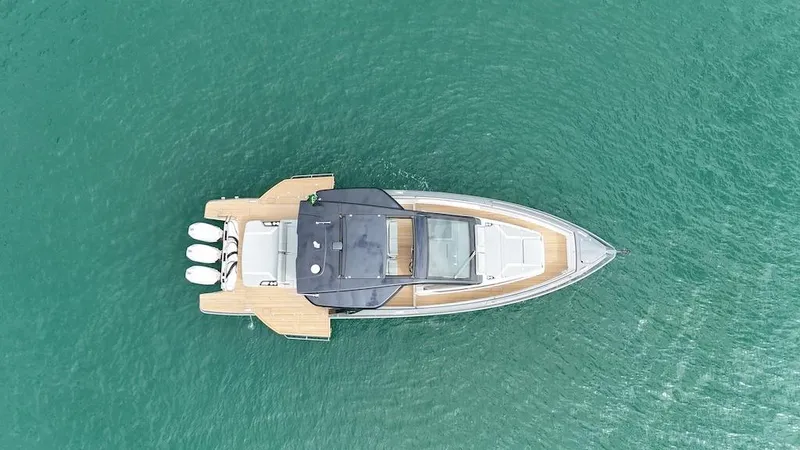 Slide: The Image of Aerial view of 2025 Schaefer V44 yacht on turquoise water. - 8