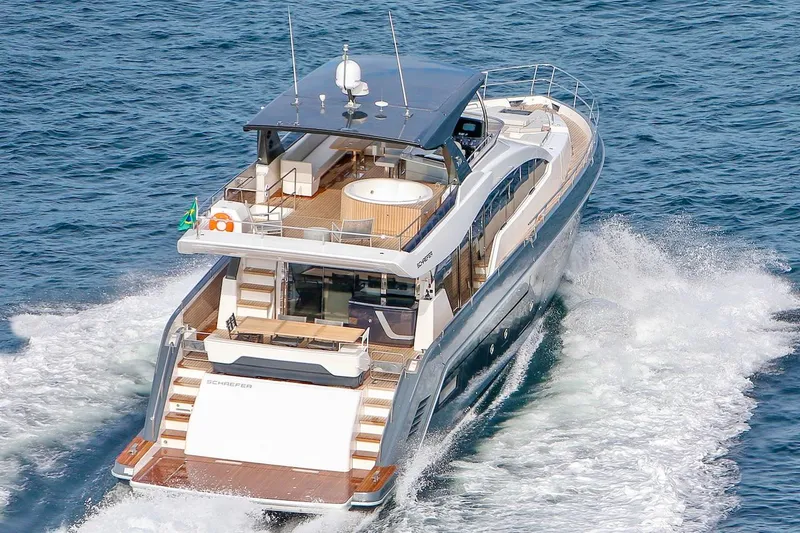 Slide: The Image of Luxury Schaefer 770 yacht cruising on the ocean, 2025 model. - 1