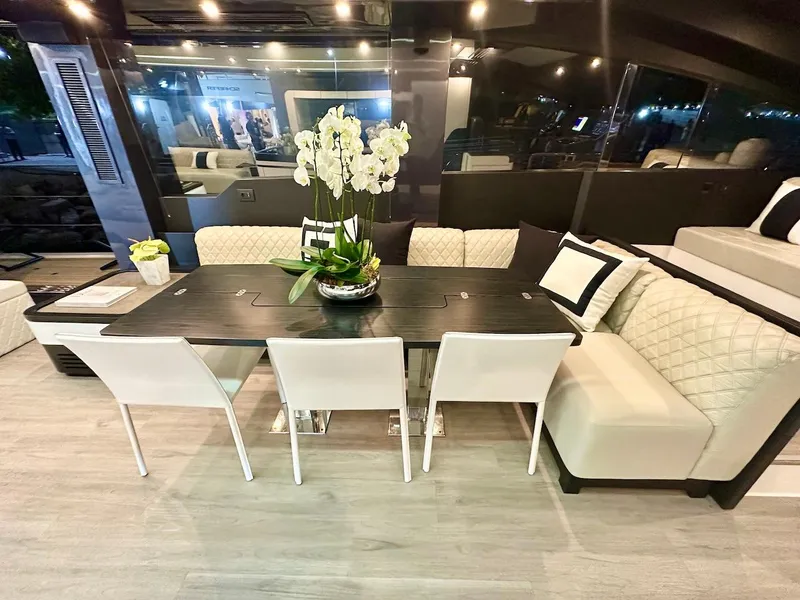 Slide: The Image of Luxurious interior of Schaefer 770 yacht, 2025 model, featuring elegant dining area with modern decor. - 20