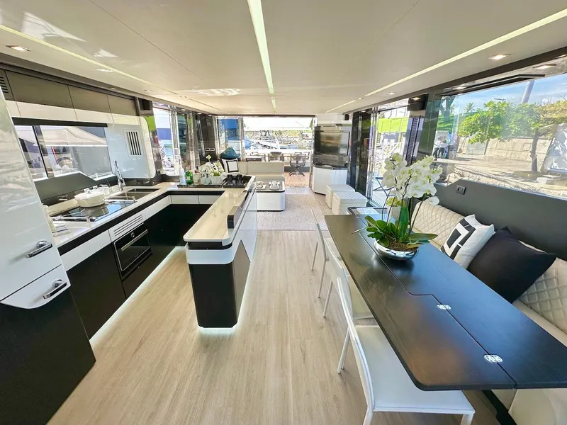 Slide: The Image of Luxurious interior of 2025 Schaefer 770 yacht with modern kitchen and dining area. - 24