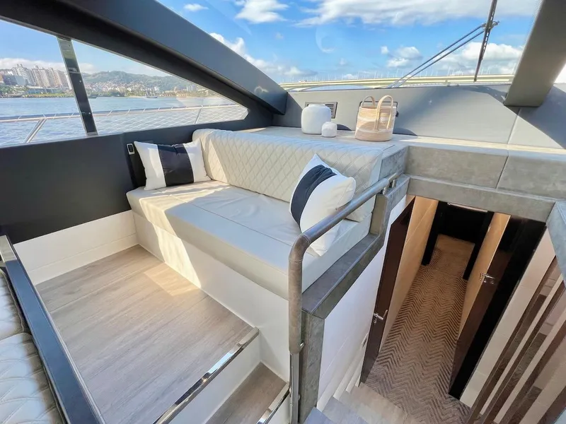 Slide: The Image of Luxurious interior of 2025 Schaefer 770 yacht with modern seating and scenic views. - 25