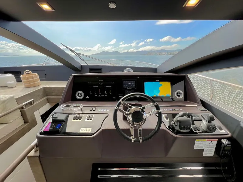 Slide: The Image of Modern Schaefer 770 yacht cockpit with advanced navigation systems, luxurious interior, and ocean view. - 27