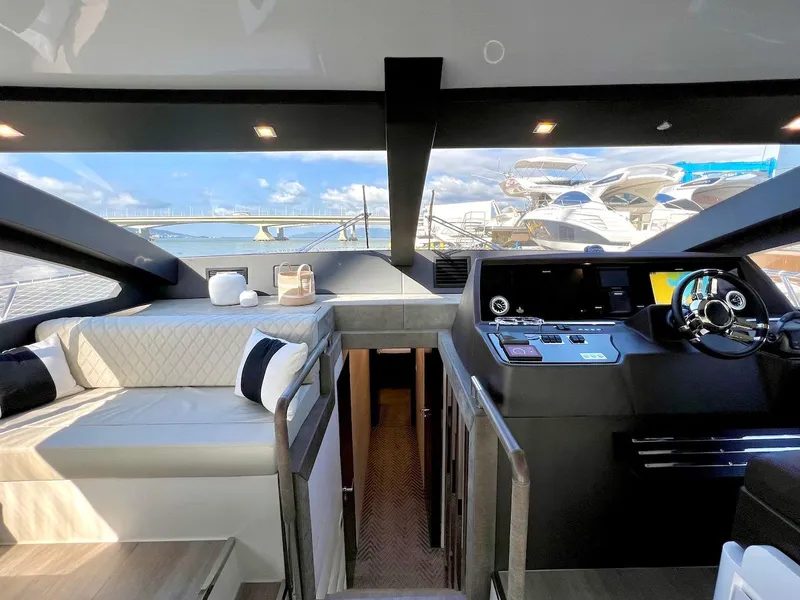 Slide: The Image of Interior of 2025 Schaefer 770 yacht with modern helm and seating area. - 28