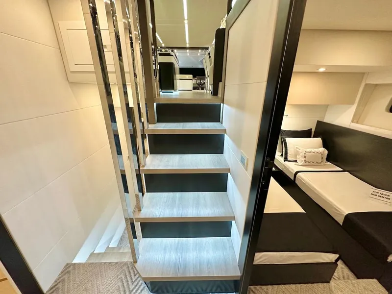 Slide: The Image of Modern interior of Schaefer 770 yacht, 2025 model, featuring sleek stairs and cozy bedroom. - 34
