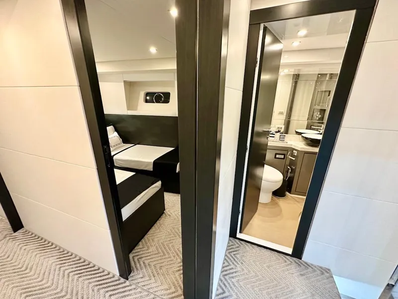 Slide: The Image of Interior of Schaefer 770 yacht, 2025 model, featuring a bedroom and bathroom. - 38