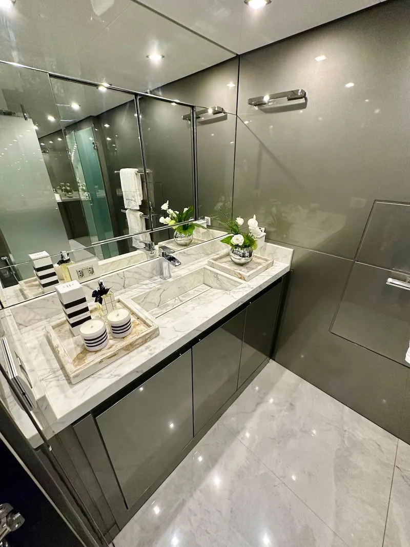 Slide: The Image of Modern bathroom in Schaefer 770 yacht, 2025 model, featuring marble countertop and sleek cabinetry. - 46