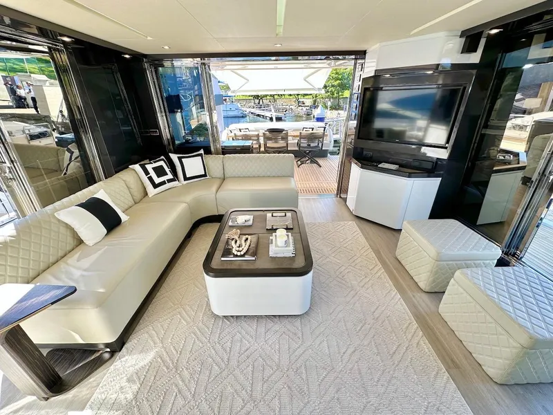 Slide: The Image of Luxurious interior of Schaefer 770 yacht, 2025 model, featuring modern seating and entertainment area. - 10