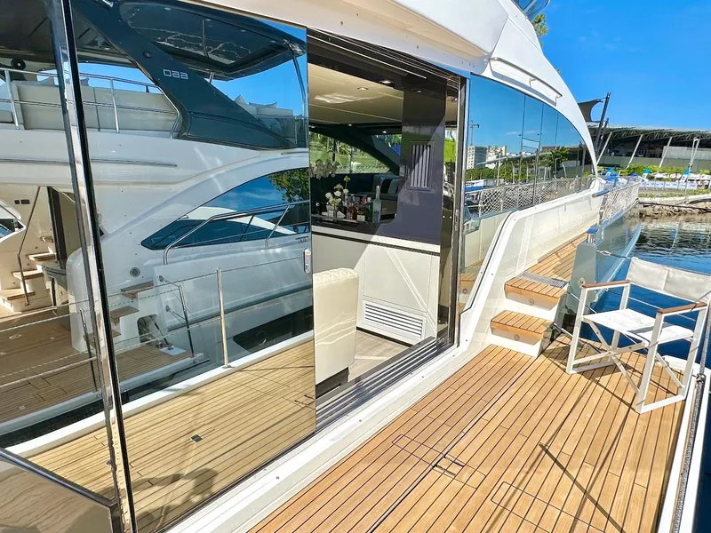 Slide: The Image of Luxury Schaefer 770 yacht, 2025 model, docked with open deck and modern interior. - 11