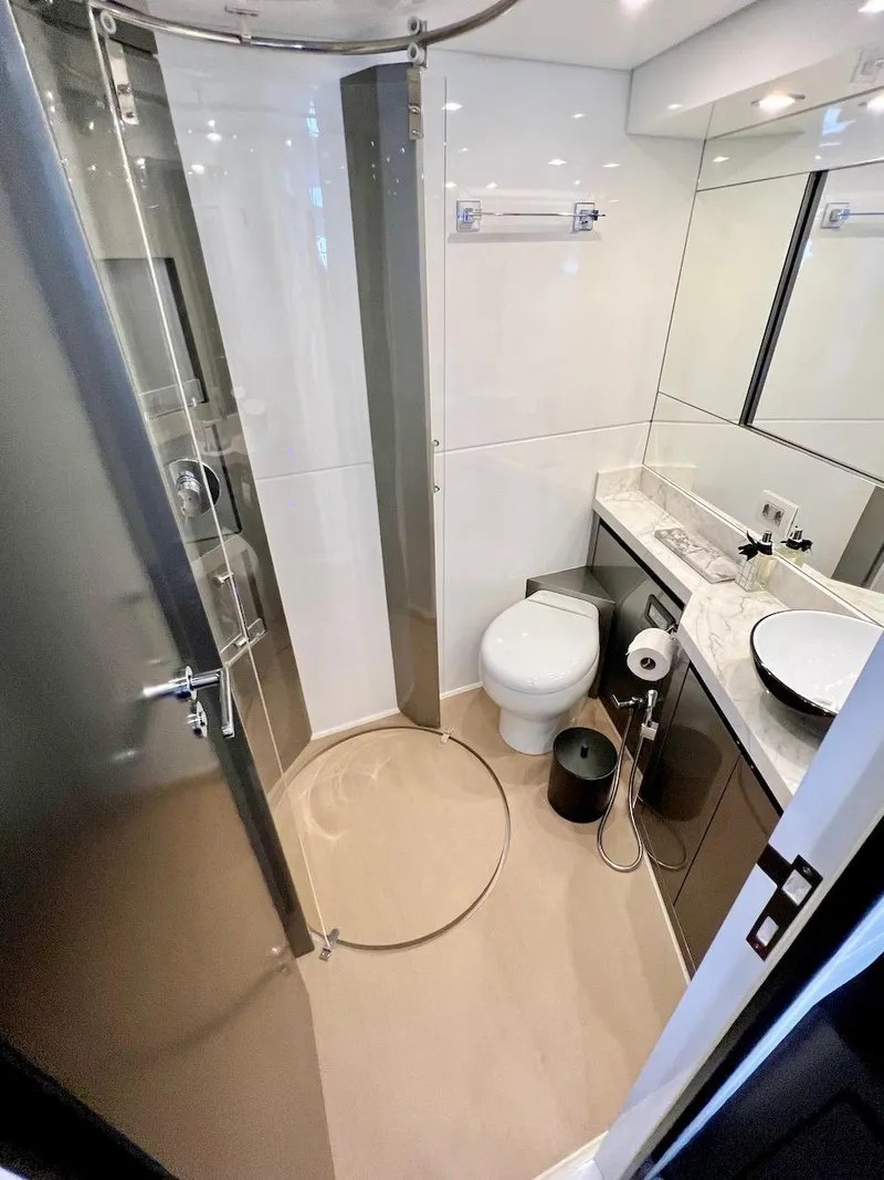 Slide: The Image of Modern bathroom in 2025 Schaefer 770 yacht with shower, toilet, and marble countertop. - 41