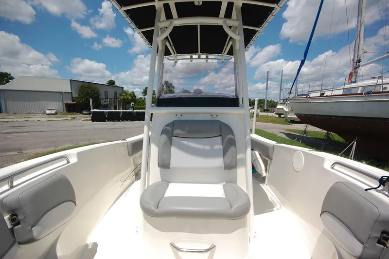 Slide: The Image of 2021 NauticStar 2102 Legacy boat interior with seating and T-top. - 13