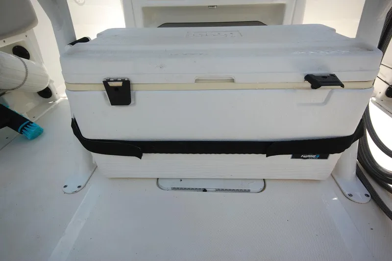 Slide: The Image of White cooler secured on a 2021 NauticStar 2102 Legacy boat. - 19