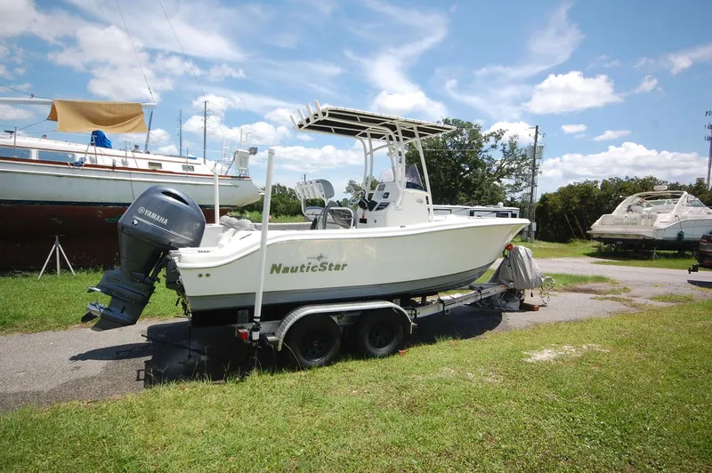 Slide: The Image of 2021 NauticStar 2102 Legacy boat on trailer with Yamaha outboard motor. - 9