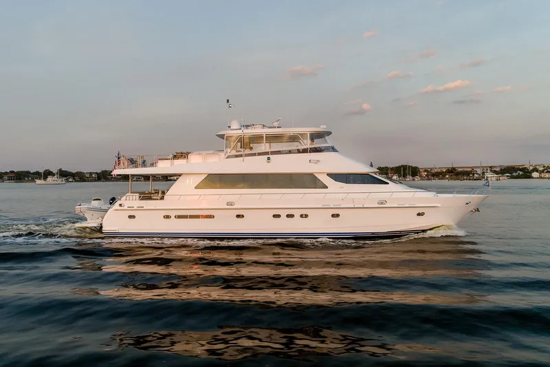 Slide: The Image of 2007 Hargrave 78 Open Bridge yacht cruising on calm waters at sunset. - 5