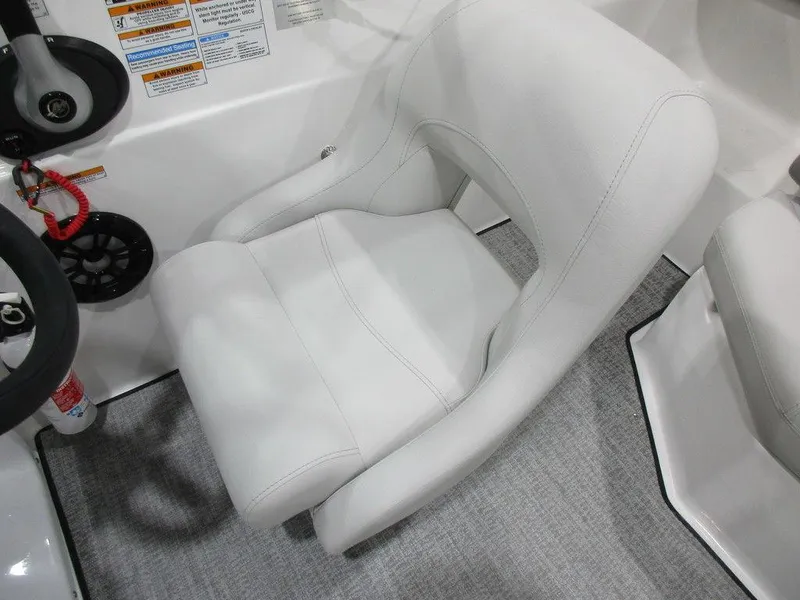 Slide: The Image of 2023 Hurricane SunDeck 187 IO boat seat with white upholstery and steering wheel. - 10