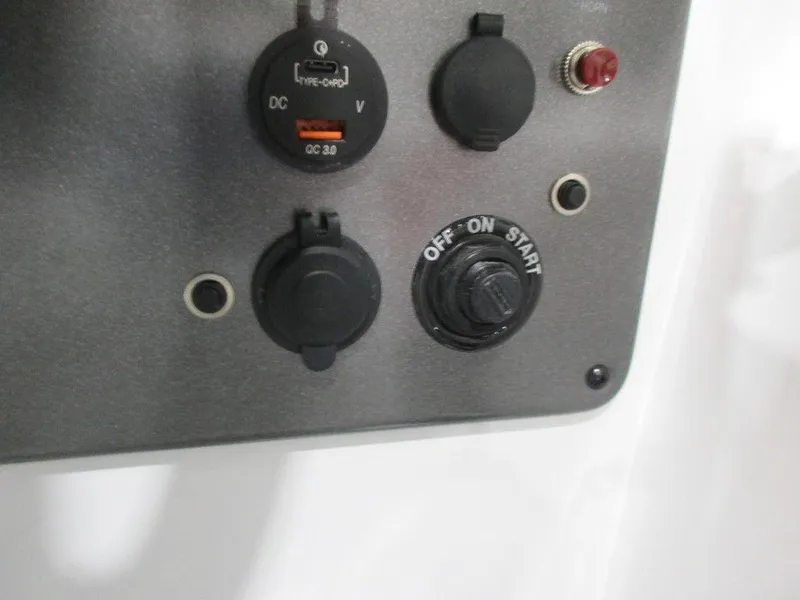 Slide: The Image of Control panel of 2023 Hurricane SunDeck 187 IO boat with switches and dials. - 13
