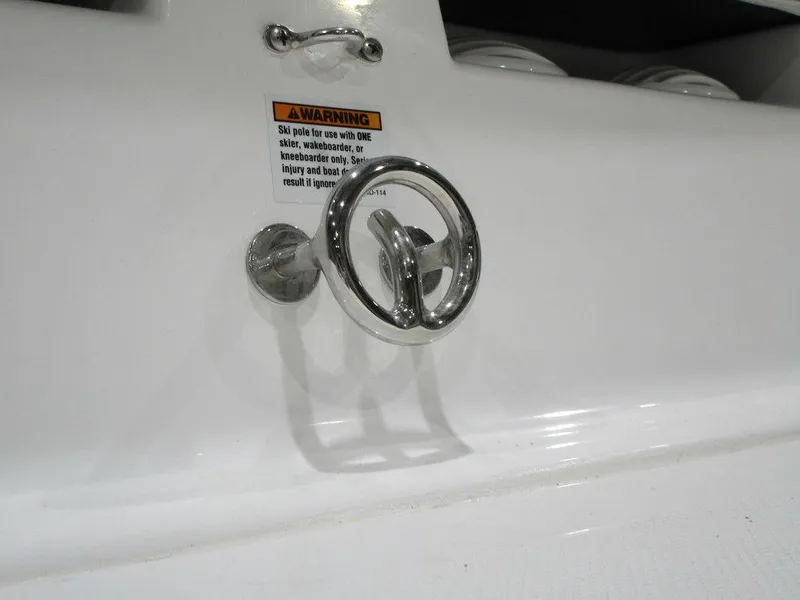 Slide: The Image of Chrome handle on 2023 Hurricane SunDeck 187 IO boat with warning label. - 14