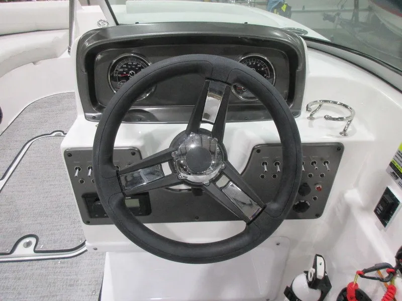 Slide: The Image of 2023 Hurricane SunDeck 187 IO boat dashboard with steering wheel and instrument panel. - 15